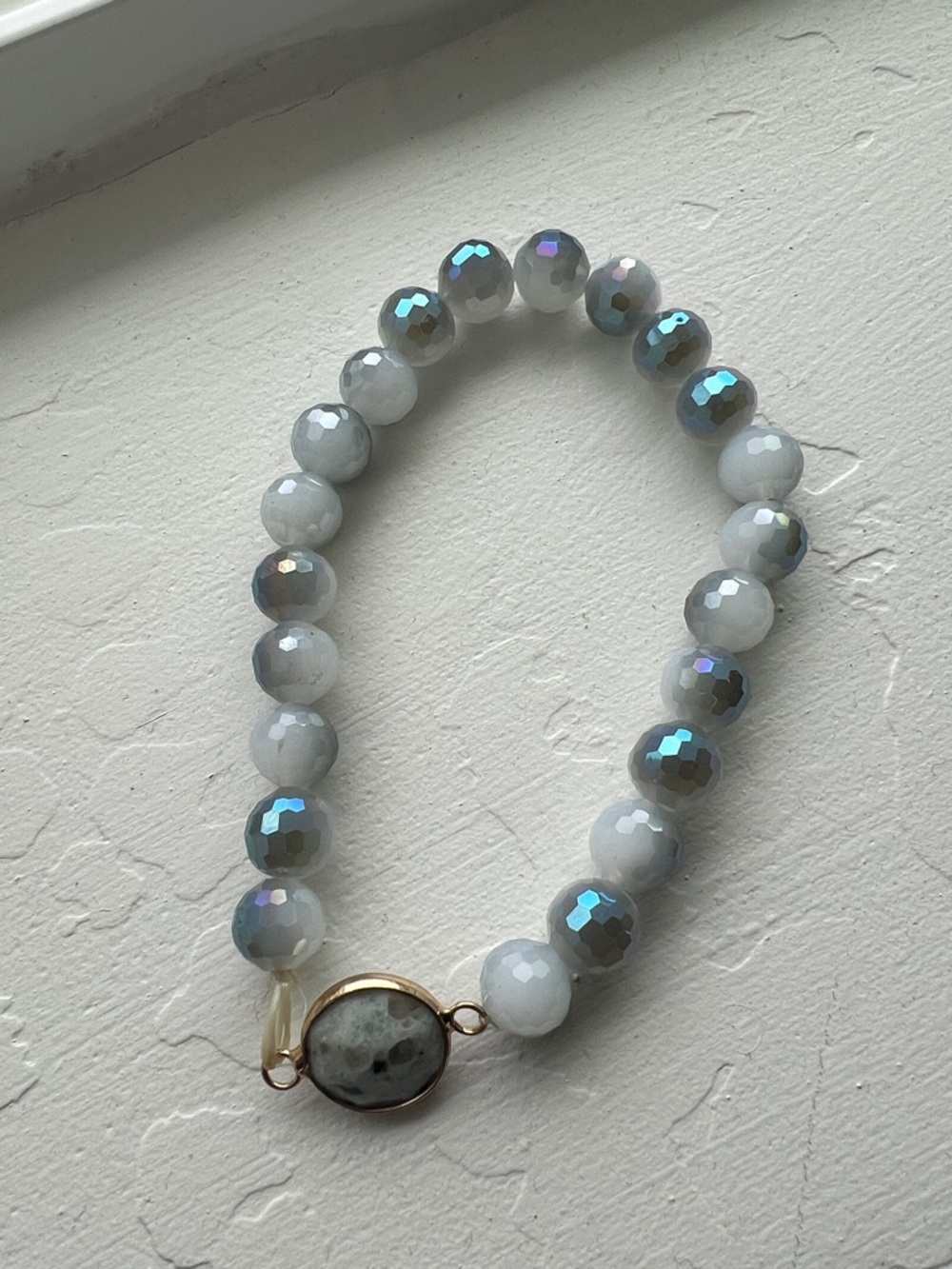 Faceted White Bead Stretch Bracelet with Iridescent Accents